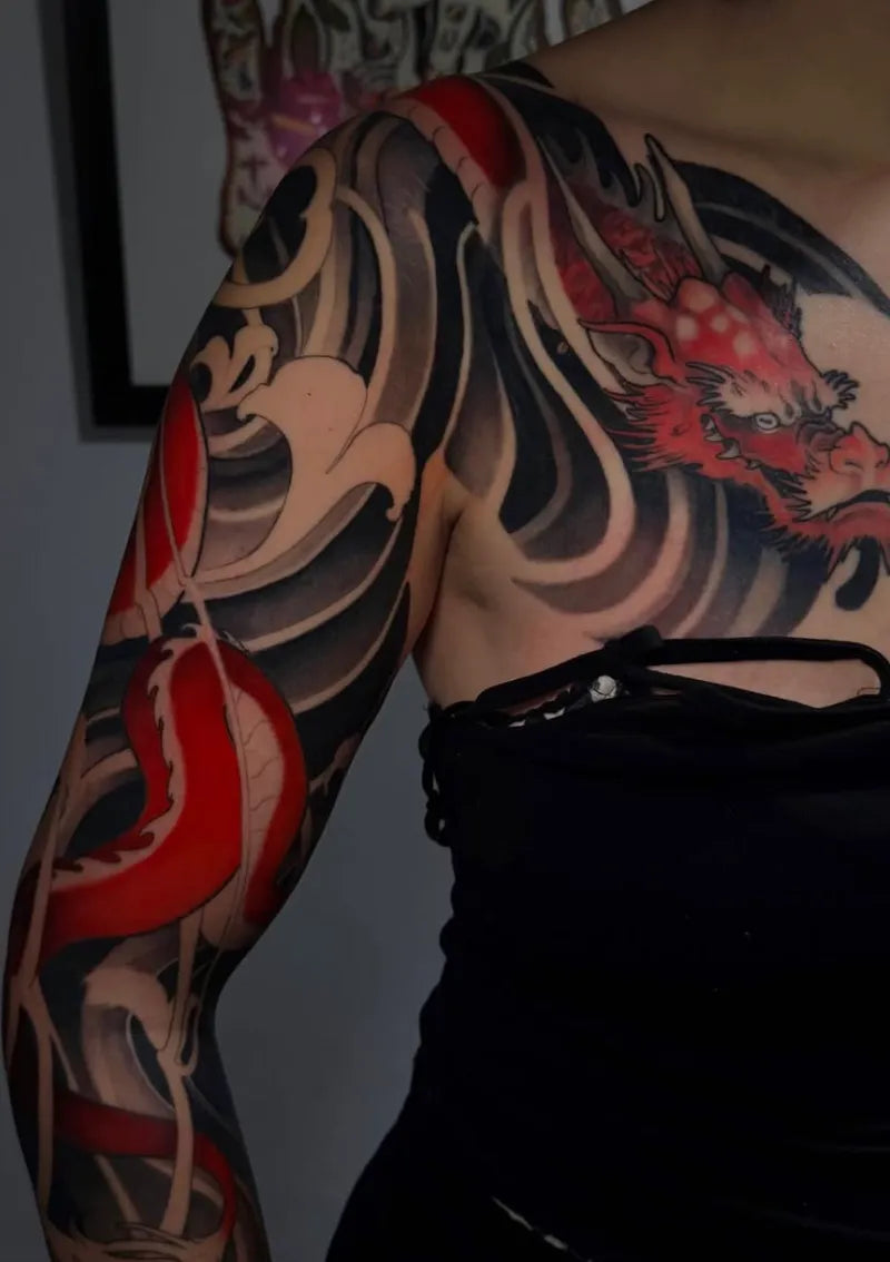 Japanese-style colour sleeve tattoo by Arantxa Encinas