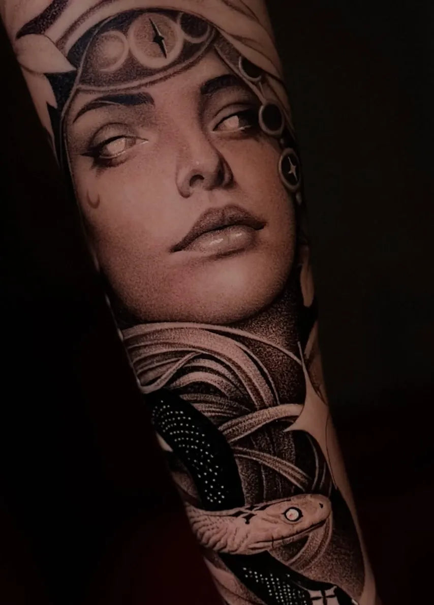 Black and grey woman and snake sleeve tattoo by Carlos Miranda