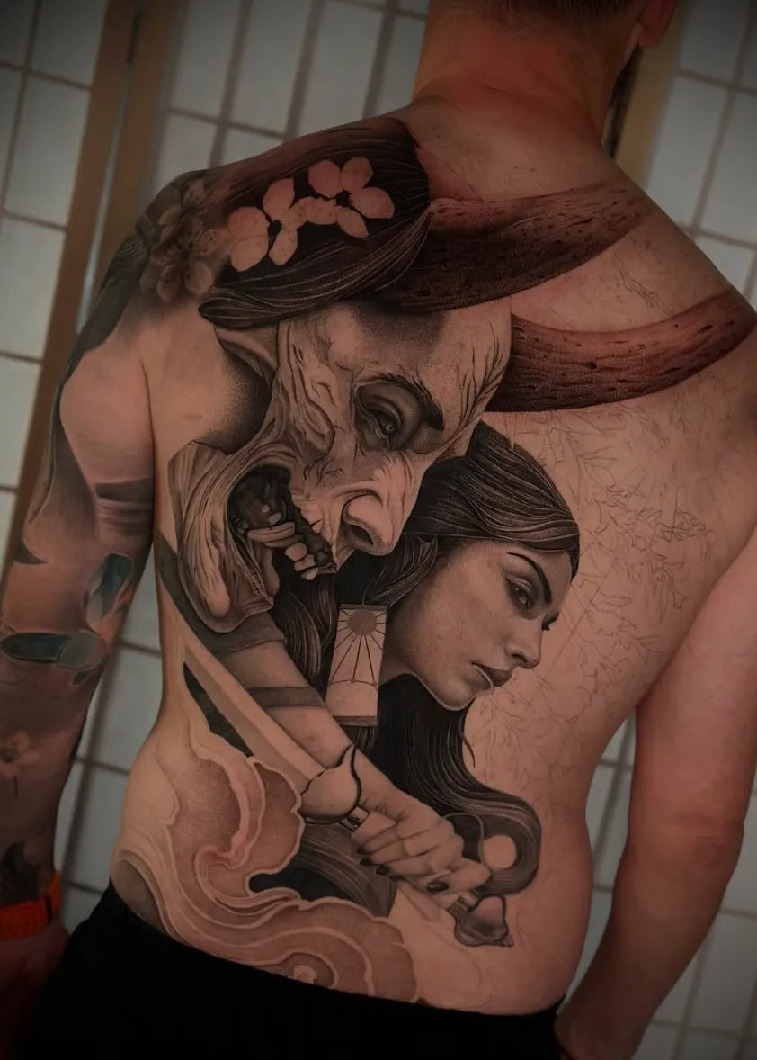 Large black and grey back piece tattoo by Carlos Miranda
