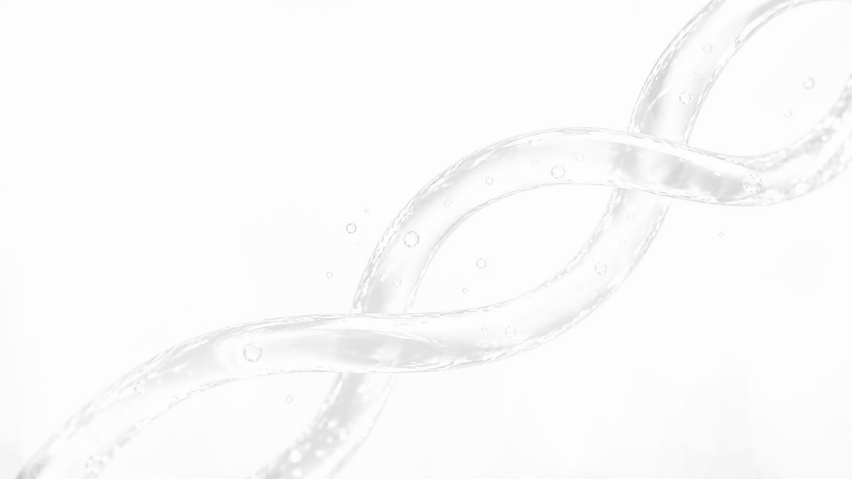 Clear liquid droplets on a white surface